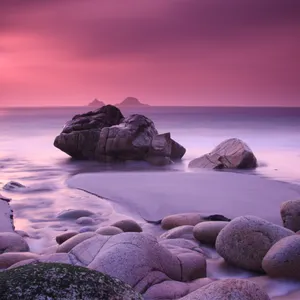 Pink Beach Sunset With Rocks Wallpaper