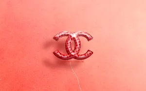 Pink Chanel Logo With Red Dots Wallpaper