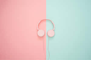 Pink Headphones On A Pink And Blue Background Wallpaper