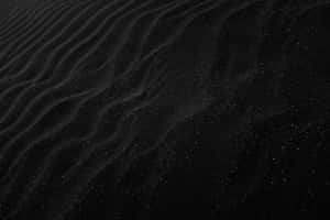 Plain Black Desktop With Sand Ridges Wallpaper