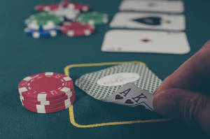 Player Checking Card Blackjack Game Wallpaper