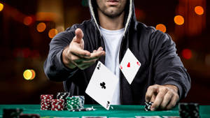 Poker Player Showing Pair Of Aces In Baccarat Game Wallpaper