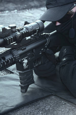 Police Holding Rifle Wallpaper