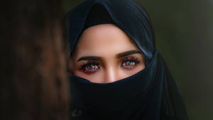 Portrait Of A Woman Wearing Black Hijab Wallpaper