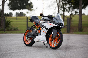 Posed Ktm Bike On Kickstand Wallpaper