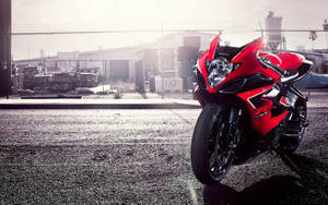 Power And Agility On Red Suzuki Gsx. Wallpaper