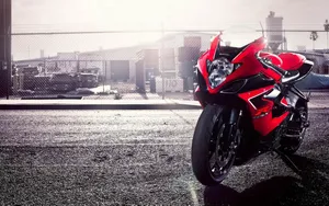 Power And Agility On Red Suzuki Gsx. Wallpaper
