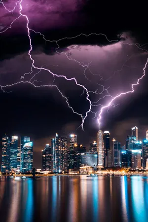 Powerful Electricity Surging Through The Night Sky Wallpaper