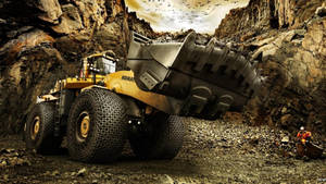 Powerful Komatsu Excavator At A Construction Site Wallpaper