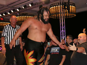 Powerhouse Wrestler Jacob Fatu Striking A Pose Wallpaper