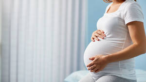 Pregnant Belly Mother In Bedroom Wallpaper