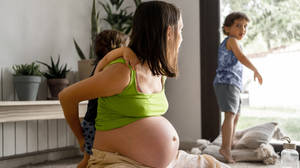 Pregnant Belly Mother Playing With Kids Wallpaper