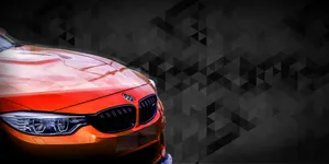 Pristine Car Detailing On A Vibrant Orange Vehicle Wallpaper