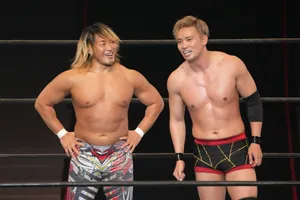 Pro Wrestlers Smilingin Ring Wallpaper