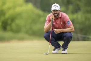 Professional Golfer Adam Hadwin In Action During A Golf Tournament Wallpaper
