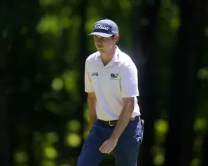 Professional Golfer J.t. Poston In Action On The Course. Wallpaper