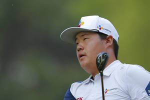 Professional Golfer Sungjae Im Focused On His Next Move At A Golf Tournament. Wallpaper