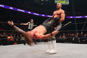 Professional Wrestler, Claudio Castagnoli, In A Gripping Showdown With Chris Jericho. Wallpaper