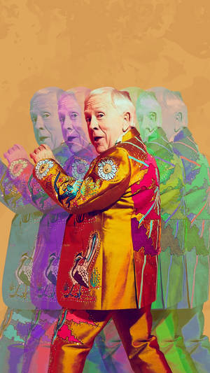 Prolific Actor Leslie Jordan Posing Elegantly Against A Multicolored Backdrop. Wallpaper