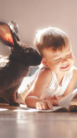 Rabbit And Child Cute 2160x3840 Wallpaper