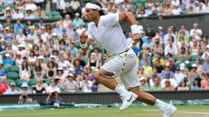 Rafael Nadal Running Across Field Wallpaper