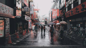 Rainy City Street In Japan Wallpaper