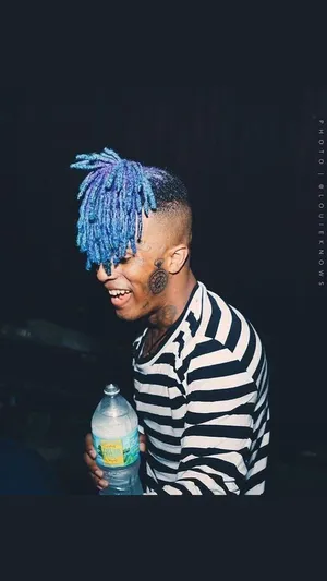 Rap Artist Xxxtentacion Poses For The Camera With Blue Hair. Wallpaper