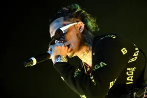Rap Star Lil Pump Performing On Stage Wallpaper