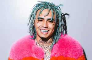 Rapper Lil Pump Illuminated Under Red Lights Wallpaper