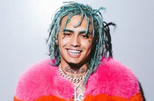Rapper Lil Pump Illuminated Under Red Lights Wallpaper