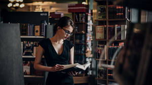 Reading Woman In Library Wallpaper