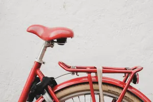 Red Bicycle Near White Wall Wallpaper