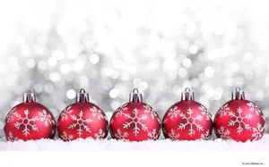 Red Christmas Balls With Snowflakes Laying On Snow Wallpaper