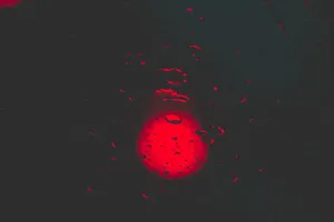 Red Circle With Water Droplets Wallpaper