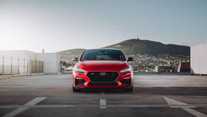 Red Hyundai In Freeway Wallpaper