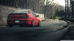 Red Mitsubishi Lancer Open Road Wallpaper