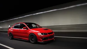 Red Mitsubishi Lancer Riding Wallpaper