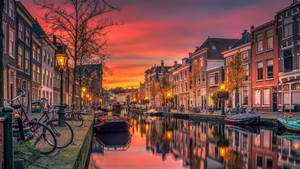 Red Sunset At Amsterdam Canal Wallpaper