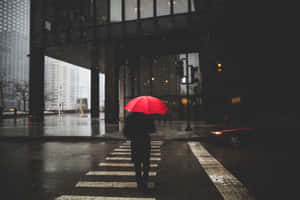 Red Umbrella Rainy Cityscape Wallpaper
