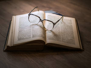 Reference Book With Eyeglasses Wallpaper