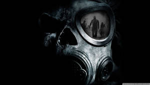 Reflected Terror: A Man In A Creepy Gas Mask Stares Back At Himself Wallpaper