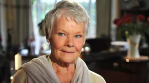 Renowned Actress Judi Dench At Home Relishing A Moment Of Tranquility Wallpaper