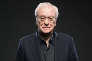 Renowned English Actor Michael Caine Exuding Elegance In Black Wallpaper