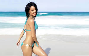 Rihanna Glows In A Bright Yellow Bikini Wallpaper