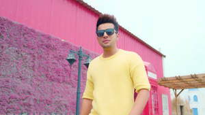 Rising Star Jass Manak In Vibrant Yellow Sweater Wallpaper