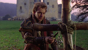 Robin Hood Kneeling At Grave Wallpaper