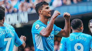 Rodrigo Hernández Cascante Fists Up Smiling Wallpaper