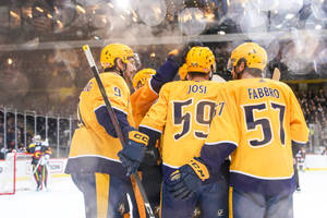 Roman Josi Dante Fabbro With Teammates Wallpaper