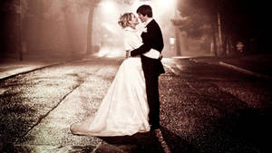 Romantic Bride And Groom On Road Wallpaper