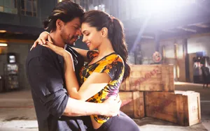 Romantic Couple Embrace Warehouse Scene Wallpaper